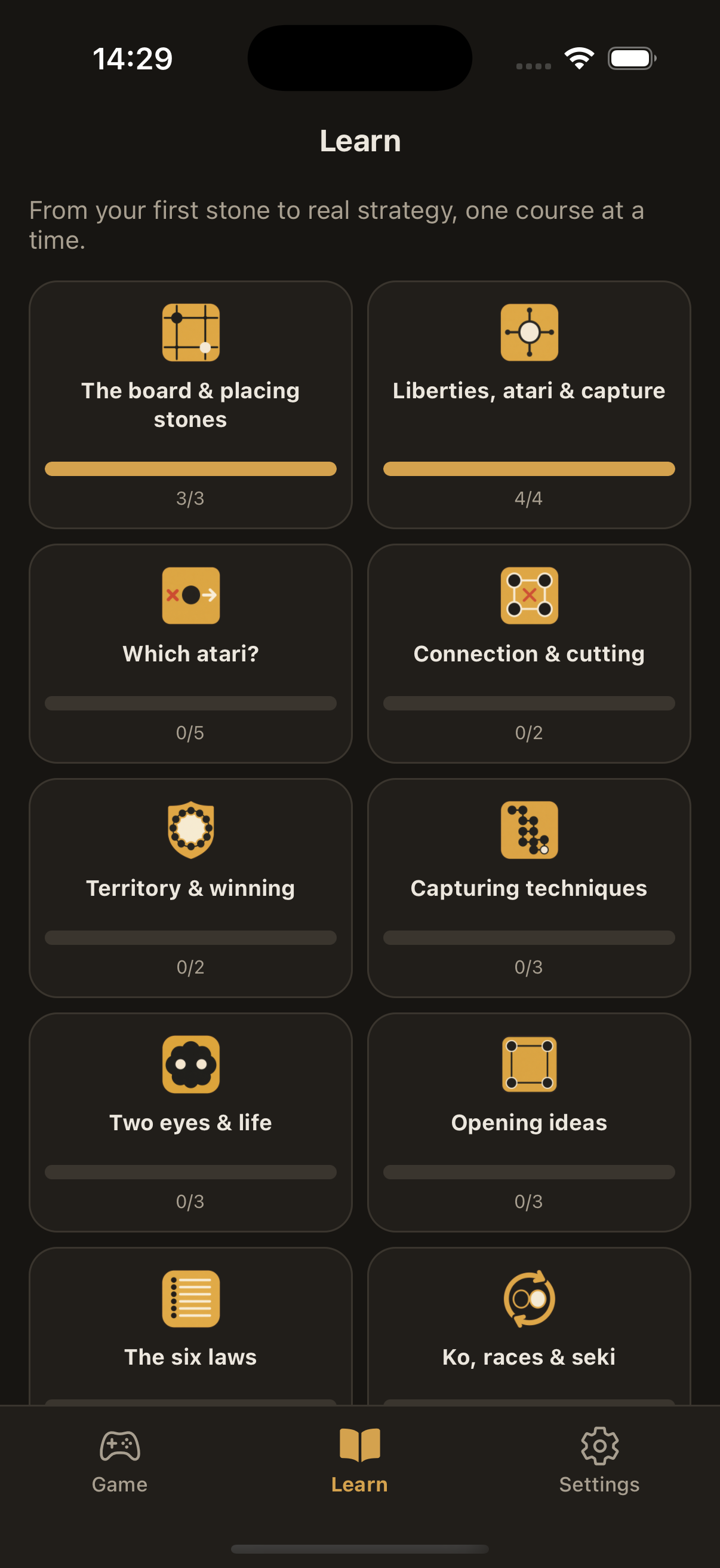 The Learn screen, a grid of courses including Two eyes and life, The six laws, Good shape and Joseki